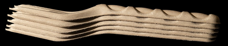 products_dining_cutlery_bagasse_06 stack of bagasse forks facing sideways
