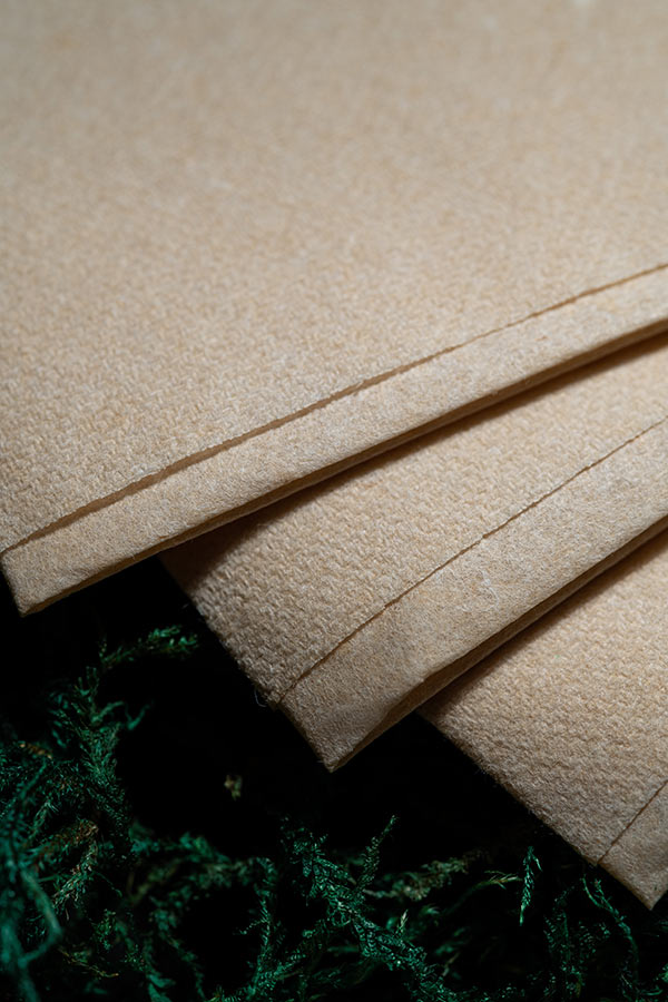 products_dining_napkins_01 Folded premium airlaid napkins on green moss