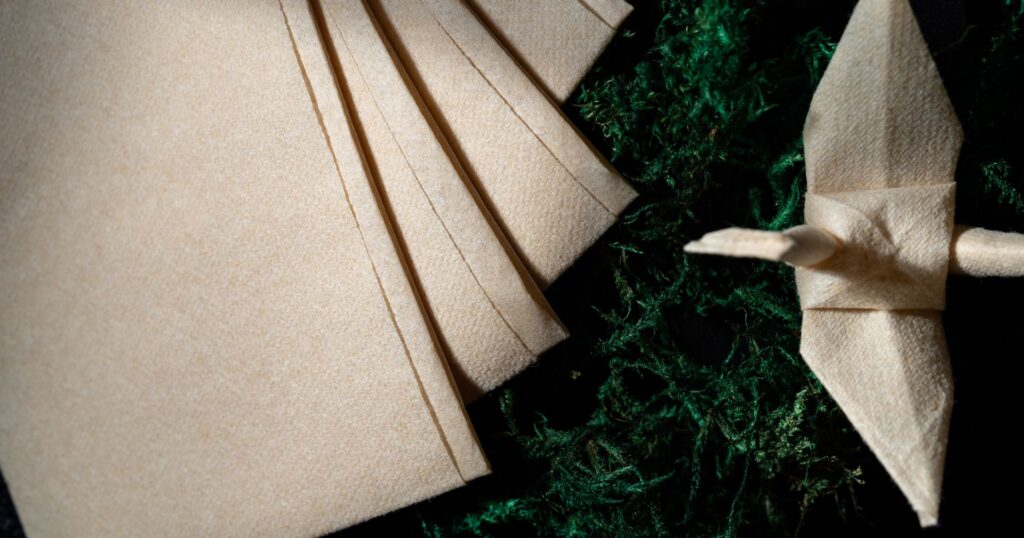 origin sustainables: aidlaid napkins in the shape of a swan, compostable disposables