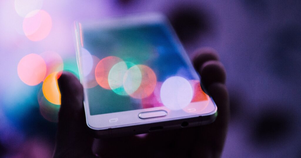 PFAS: smartphone under colourful lights