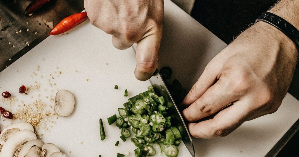 hands chopping vegetables, restaurant sustainability