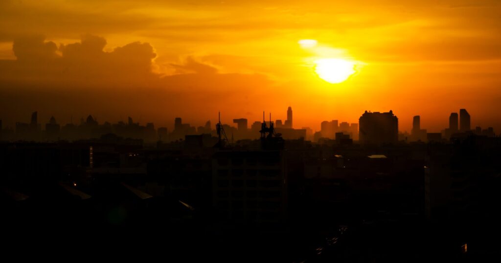 Cityscape with with sun bearing down during the global heat wave