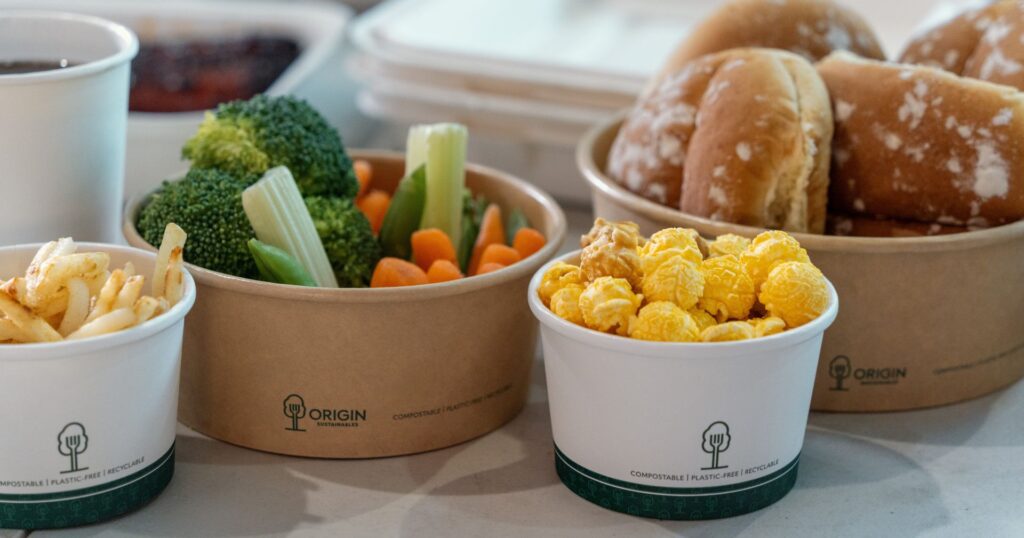 quality control in food packaging: origin sustainabels packaging with popcorn and veggies in them