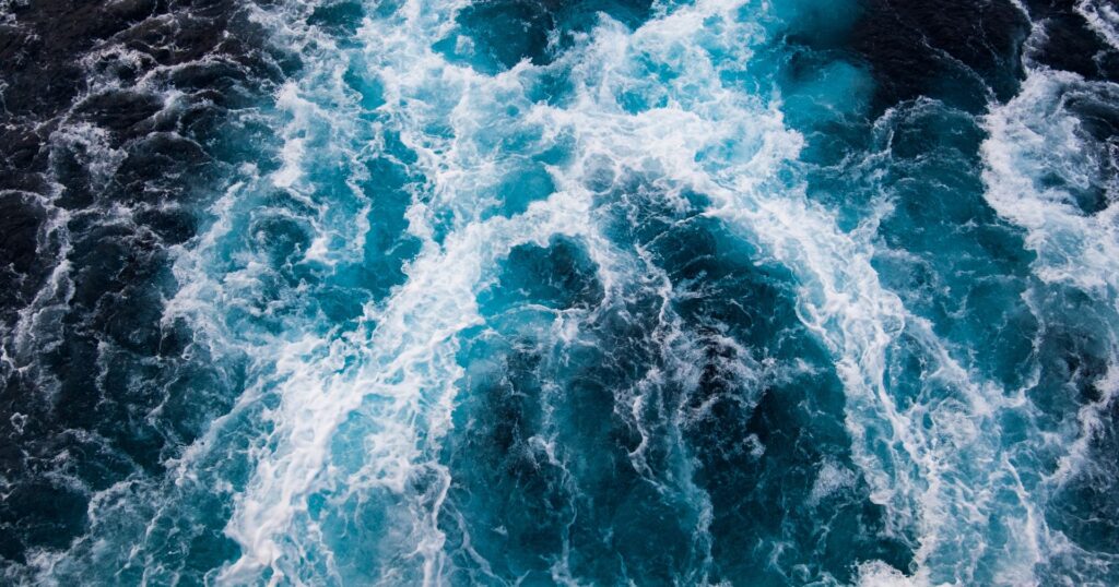 ocean waves from birds eye view, positive environmental news