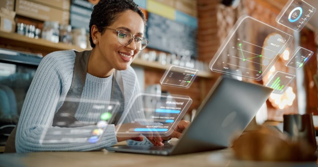 worker places takeout packaging inventory management orders behind the counter of her coffee shop